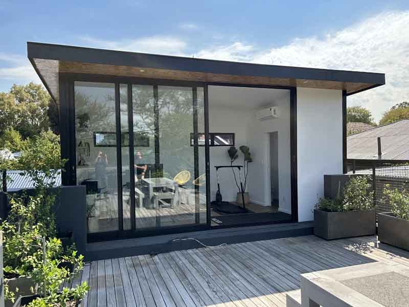 Compact xPod studio with glazing on a timber deck
